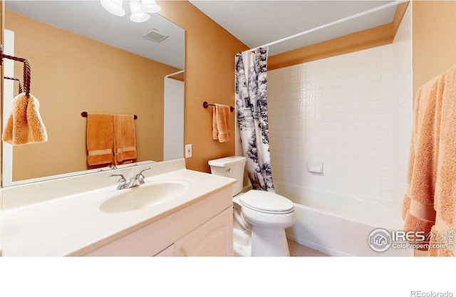 full bathroom with toilet, visible vents, shower / tub combo, and vanity