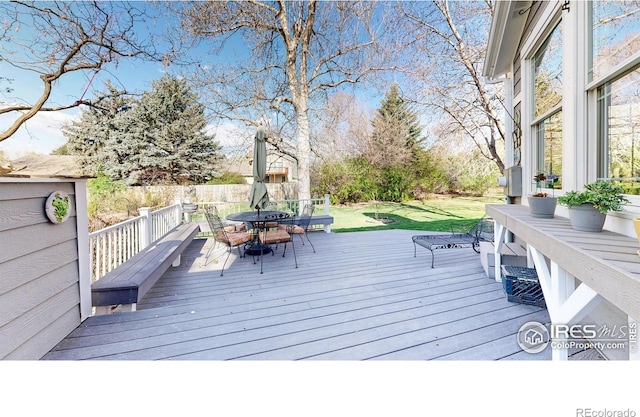 wooden deck with outdoor dining space