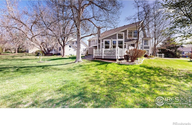 view of yard with a wooden deck