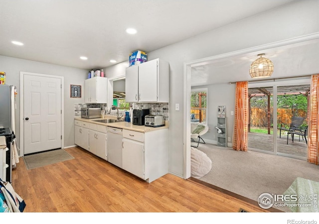 1208 Briarwood Rd, Fort Collins, CO 80521 - kitchen featuring stainless steel appliances, a sink, light countertops, white cabinets, and recessed lighting
