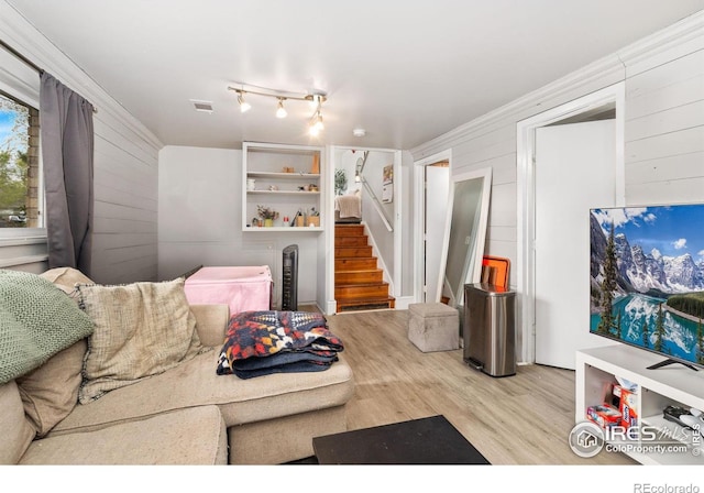 1208 Briarwood Rd, Fort Collins, CO 80521 - living room with wood finished floors, wooden walls, and stairs