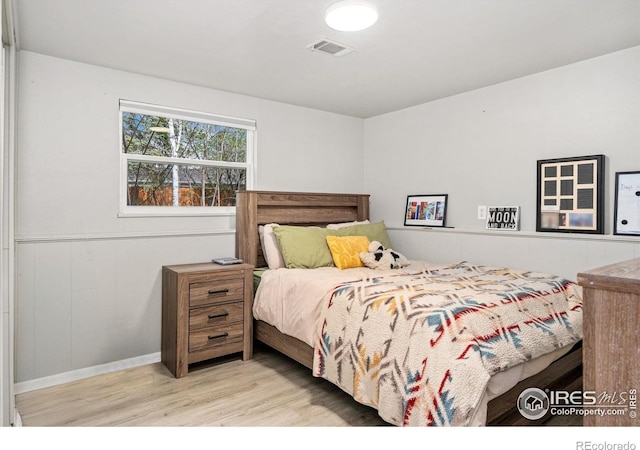 1208 Briarwood Rd, Fort Collins, CO 80521 - bedroom featuring wood finished floors, baseboards, and a wainscoted wall