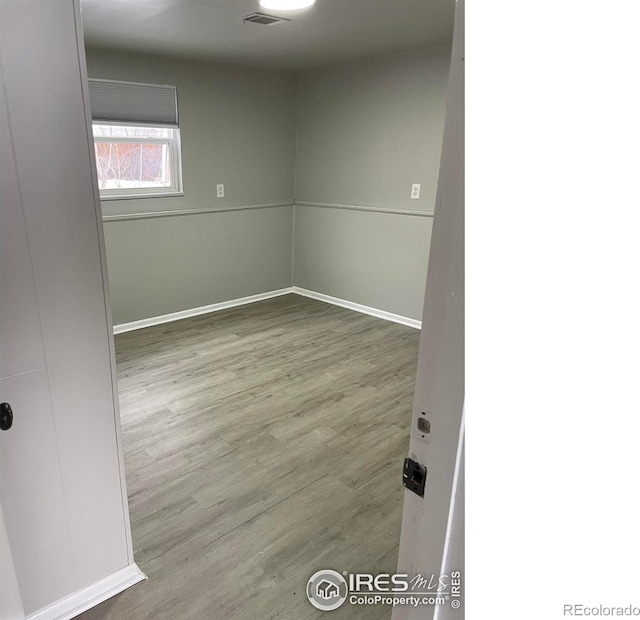 1208 Briarwood Rd, Fort Collins, CO 80521 - spare room featuring wood finished floors and baseboards