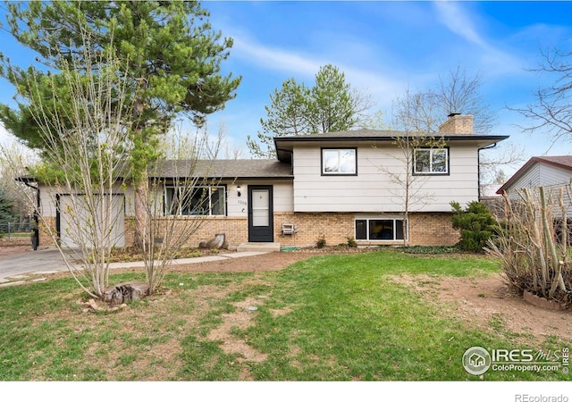 1208 Briarwood Rd, Fort Collins, CO 80521 - split level home featuring a chimney, concrete driveway, brick siding, and an attached garage
