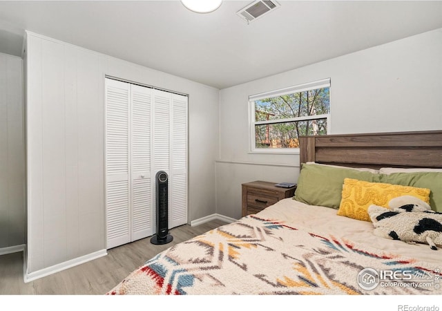 1208 Briarwood Rd, Fort Collins, CO 80521 - bedroom with wood finished floors, baseboards, and a closet