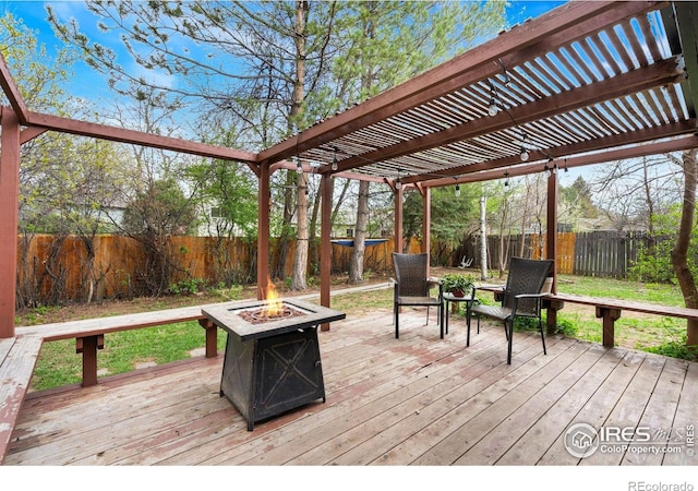 1208 Briarwood Rd, Fort Collins, CO 80521 - deck with a fire pit, a pergola, and a fenced backyard