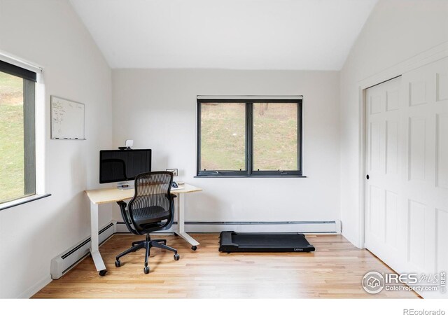 319 S Peak Rd, Boulder, CO 80302 - home office featuring vaulted ceiling, baseboard heating, and wood finished floors