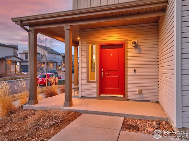 entrance to property with covered porch