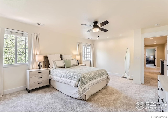 bedroom featuring recessed lighting, baseboards, visible vents, and light carpet