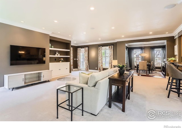 living room featuring crown molding, recessed lighting, and light carpet