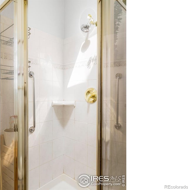 bathroom featuring a stall shower