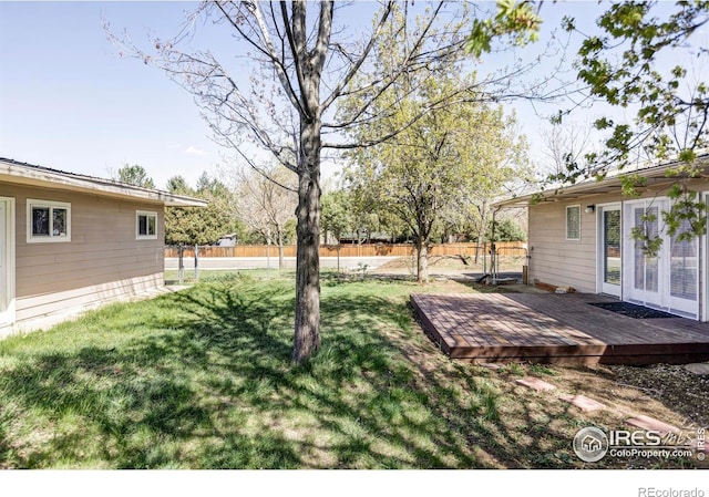 view of yard featuring a wooden deck