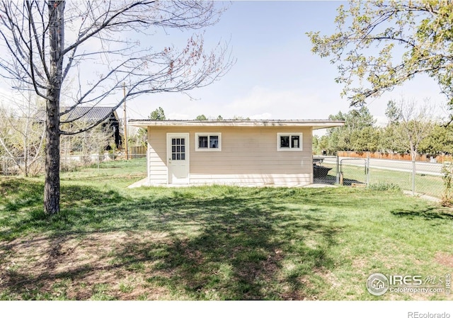 back of house with an outdoor structure