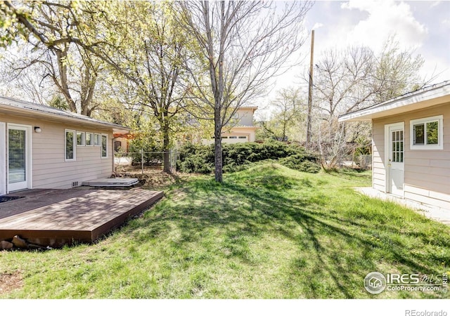 view of yard with a wooden deck