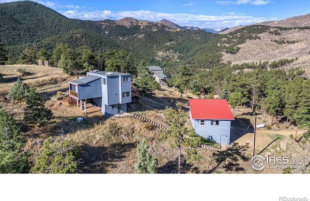 319 Camino Bosque, Boulder, CO 80302 - view from above of property with mountains and a heavily wooded area