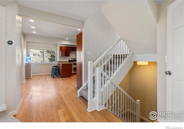 319 Camino Bosque, Boulder, CO 80302 - stairs featuring wood finished floors, recessed lighting, and baseboards
