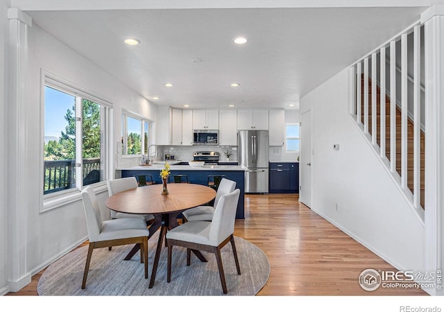 251 Ridgeview Ln, Boulder, CO 80302 - dining room with light wood-style flooring, recessed lighting, stairway, and baseboards