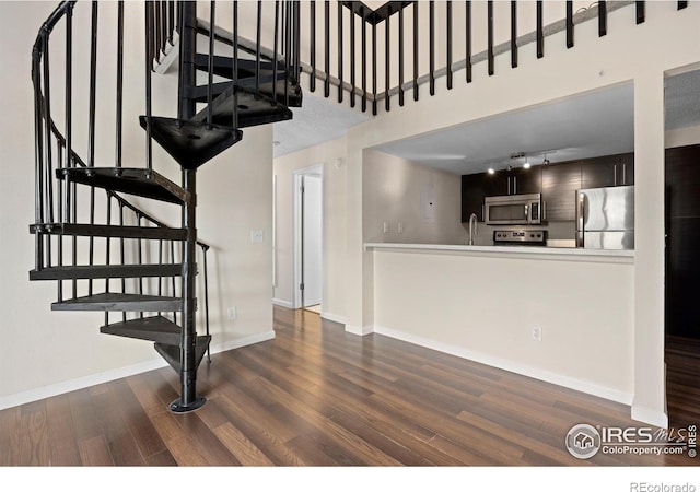 6385 Oak St Unit 301, Arvada, CO 80004 - staircase with wood finished floors and track lighting