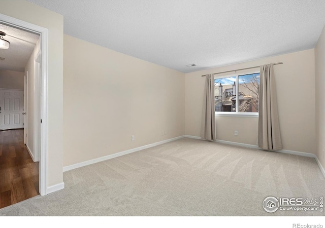 6385 Oak St Unit 301, Arvada, CO 80004 - unfurnished room with carpet and a textured ceiling