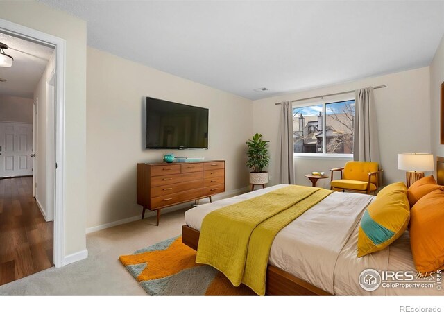 6385 Oak St Unit 301, Arvada, CO 80004 - bedroom with baseboards and carpet floors