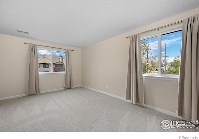 6385 Oak St Unit 301, Arvada, CO 80004 - spare room featuring carpet flooring and baseboards