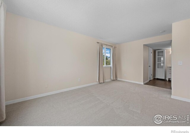 6385 Oak St Unit 301, Arvada, CO 80004 - empty room featuring carpet floors and a textured ceiling
