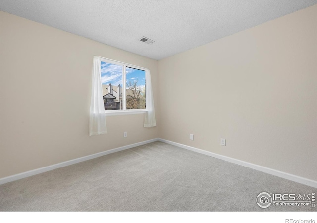 6385 Oak St Unit 301, Arvada, CO 80004 - unfurnished room featuring carpet floors and a textured ceiling