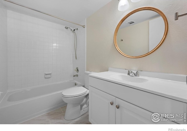 6385 Oak St Unit 301, Arvada, CO 80004 - bathroom with vanity, shower / tub combination, and marble look tile flooring