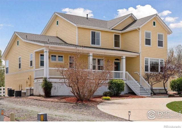 3530 Willow Rd, Frederick, CO 80504 - view of front facade with a porch, central AC, stairway, and a shingled roof