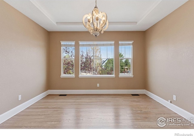 3530 Willow Rd, Frederick, CO 80504 - empty room with an inviting chandelier, a tray ceiling, and a wealth of natural light