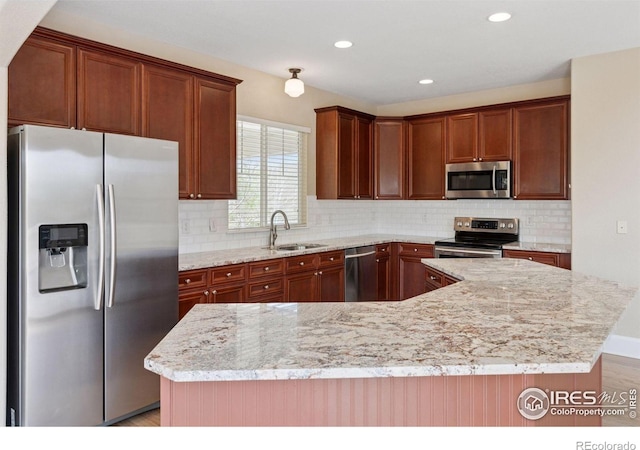 3530 Willow Rd, Frederick, CO 80504 - kitchen with a sink, appliances with stainless steel finishes, tasteful backsplash, and recessed lighting