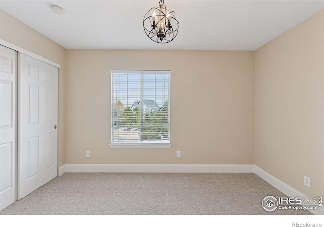 3530 Willow Rd, Frederick, CO 80504 - interior space featuring a closet, baseboards, carpet flooring, and a notable chandelier