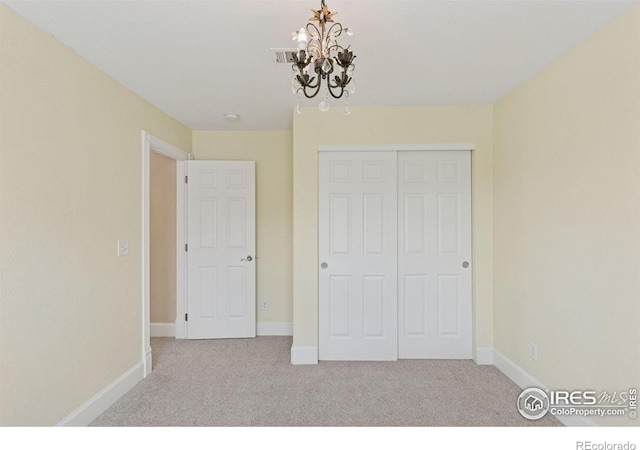 3530 Willow Rd, Frederick, CO 80504 - unfurnished bedroom with carpet floors, baseboards, a notable chandelier, and a closet