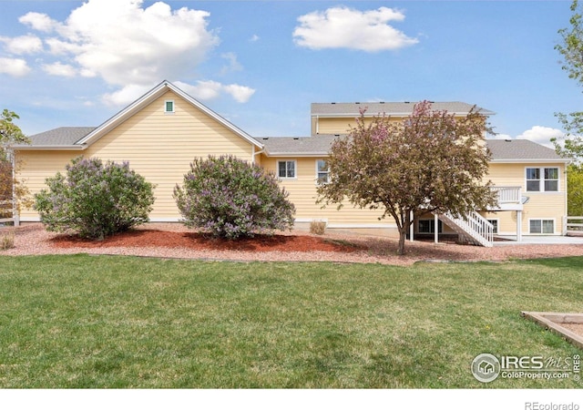 3530 Willow Rd, Frederick, CO 80504 - rear view of property with stairs, a lawn, and a wooden deck
