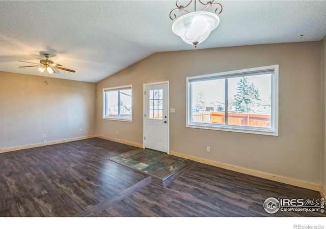 entryway with vaulted ceiling, a textured ceiling, a ceiling fan, and wood finished floors