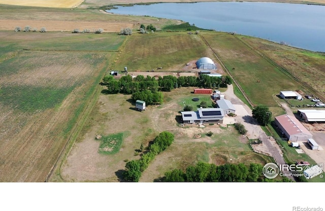 drone / aerial view with a water view and a rural view