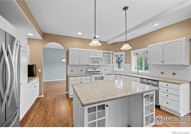 2275 Schooner St, Lafayette, CO 80026 - kitchen with backsplash, appliances with stainless steel finishes, open shelves, white cabinets, and recessed lighting