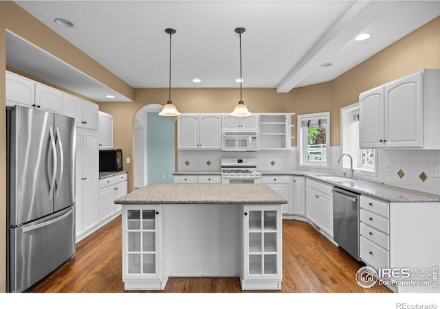 2275 Schooner St, Lafayette, CO 80026 - kitchen with a sink, a kitchen island, stainless steel appliances, and dark wood-style floors