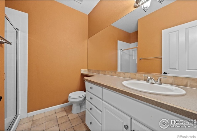 2275 Schooner St, Lafayette, CO 80026 - full bath featuring tile patterned flooring, an enclosed shower, toilet, and vanity