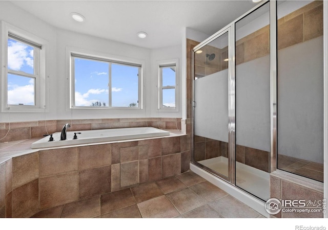2275 Schooner St, Lafayette, CO 80026 - bathroom featuring a bath, a stall shower, and a healthy amount of sunlight