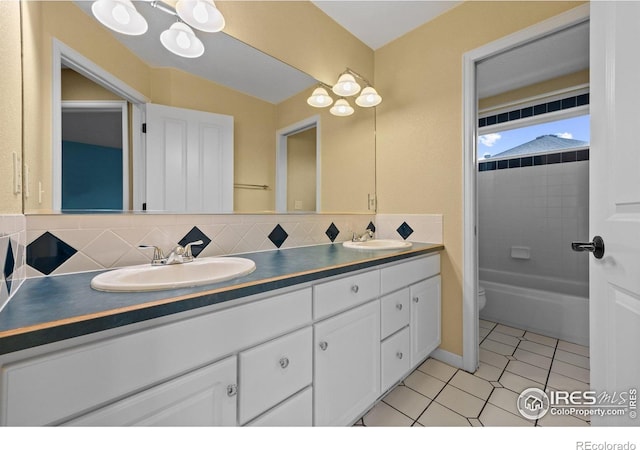 2275 Schooner St, Lafayette, CO 80026 - bathroom featuring double vanity, a sink, tile patterned flooring, and tasteful backsplash