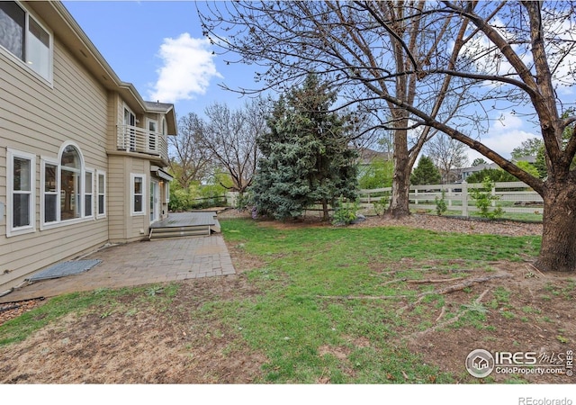 2275 Schooner St, Lafayette, CO 80026 - view of yard featuring a patio, fence, and a balcony