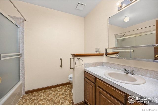 1183 38th Ave, Greeley, CO 80634 - bathroom featuring vanity and shower / bath combination with glass door