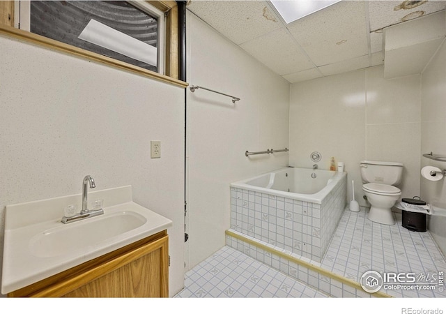 1183 38th Ave, Greeley, CO 80634 - full bathroom with a paneled ceiling, a garden tub, tile patterned flooring, and vanity