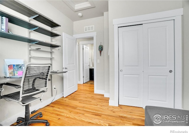 541 Hoyt Ln, Lafayette, CO 80026 - home office with baseboards, visible vents, and light wood-type flooring
