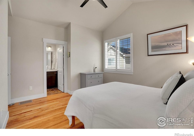 541 Hoyt Ln, Lafayette, CO 80026 - bedroom with visible vents, baseboards, connected bathroom, lofted ceiling, and light wood-style flooring