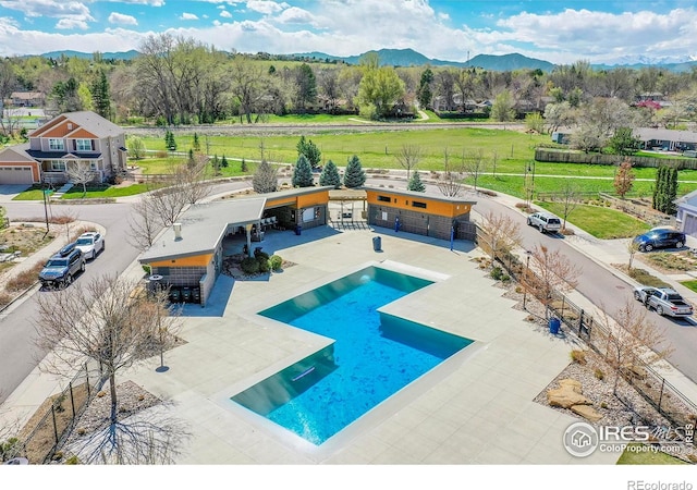 541 Hoyt Ln, Lafayette, CO 80026 - pool with fence, a mountain view, and a patio area