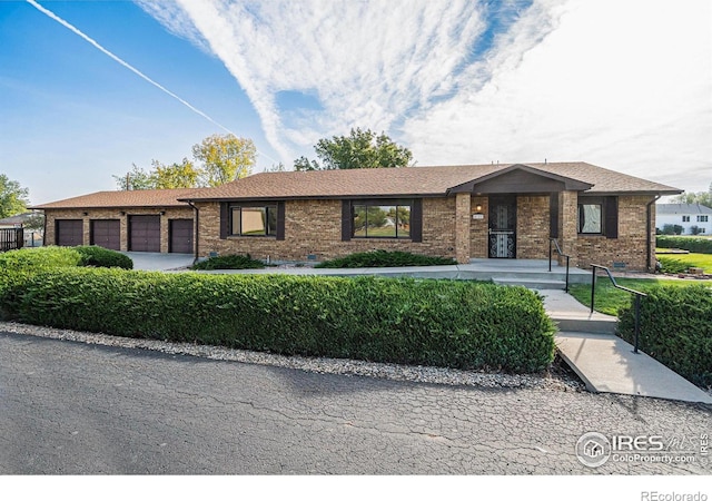 4121 Silene Pl, Loveland, CO 80537 - ranch-style home with brick siding and a garage