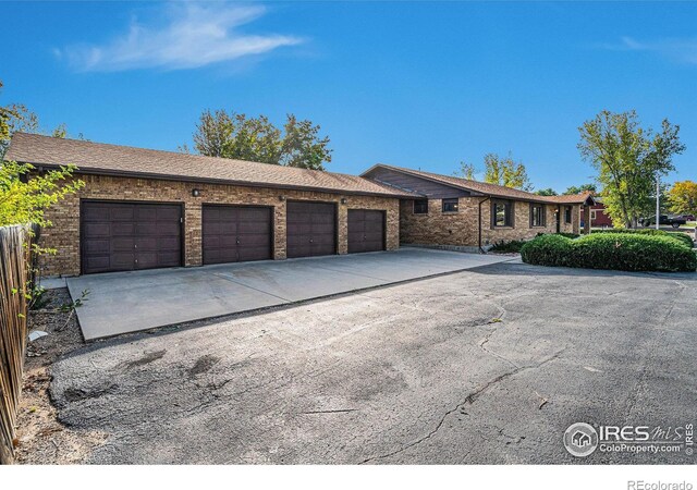 4121 Silene Pl, Loveland, CO 80537 - single story home featuring an attached garage, concrete driveway, and brick siding