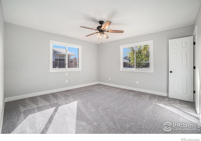 4121 Silene Pl, Loveland, CO 80537 - spare room featuring carpet floors, a ceiling fan, baseboards, and visible vents